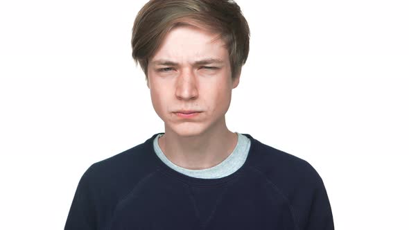 Portrait of Young Aggressive Teen Looking on Someone Showing I'm Watching you with Fingers Squinting alt