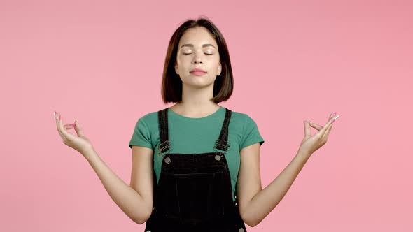 Calm Woman with Brunette Hair Relaxing, Meditating. Girl Calms Down, Breathes Deeply with Mudra Om alt