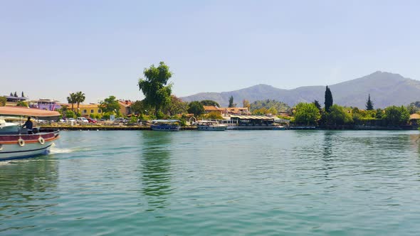 Inspection of the Banks of the River Dalyan with Moored Boats and Mountain Landscapes alt