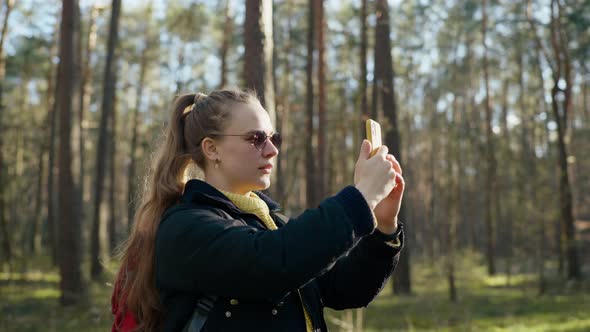 the Girl Got Lost in the Forest and is Looking for a Mobile Connection alt