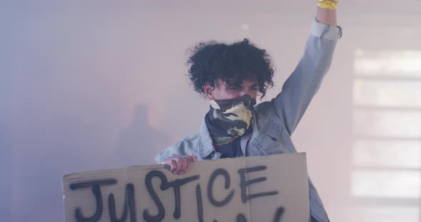 Diverse group of people wearing face masks holding protest signs raising fists alt