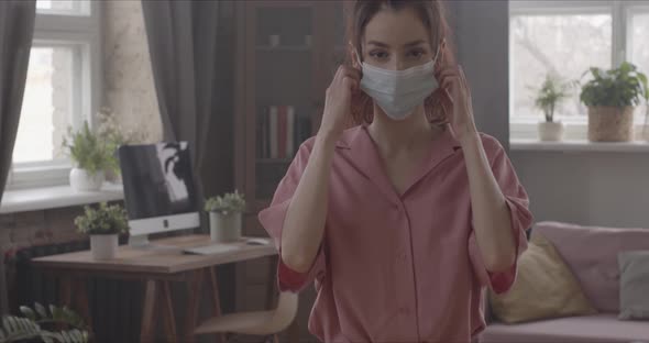 Happy Woman Takes Off The Surgical Mask From Her Face  Straight Into The Camera