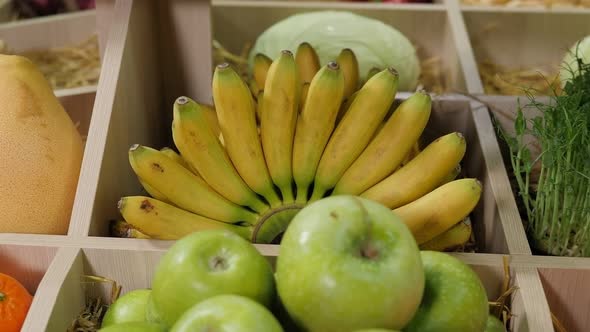 Closeup of Various Fruits on the Shelves in the Store Green Apples and Bananas alt