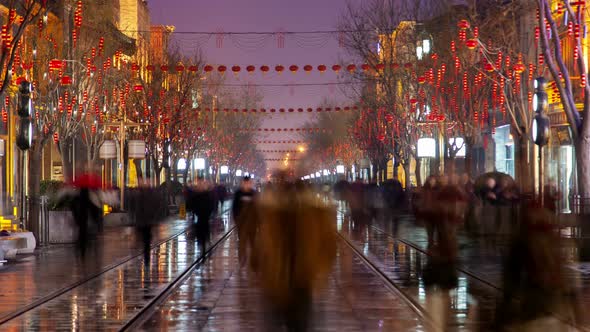 Chinese People Walk on Qianmen Street in Beijing Timelapse alt