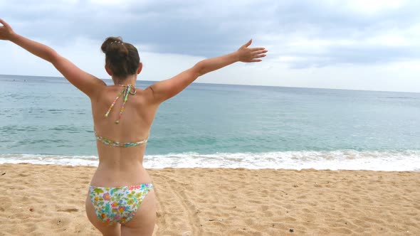 Follow Young Happy Woman Running on Beach To the Ocean and Raised Hands. Beautiful Girl Jogging on alt