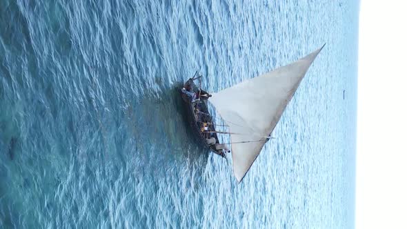 Vertical Video Boats in the Ocean Near the Coast of Zanzibar Tanzania Aerial View alt