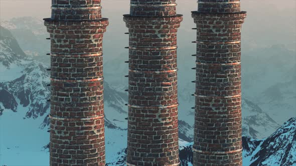 Brick Chimney on the Against the Backdrop of a Snowy Mountain Landscape alt