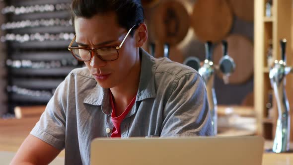 Man sitting in a restaurant 4k alt