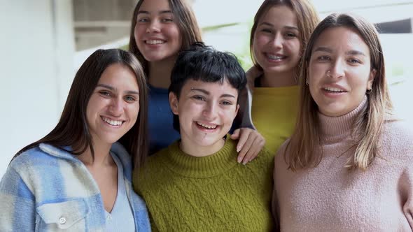 Young diverse women smiling on camera