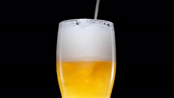 Light Beer is Pouring Into Glass