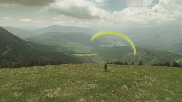 Man With A Paraglider Chased By A Drone alt