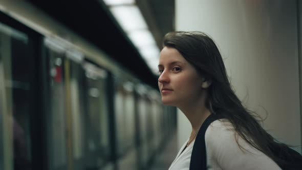 Woman standing on a subway platform