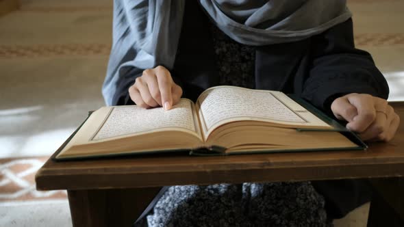 Islamic Holly Book Quran Masked Muslim Woman Reading Quran at Masjid alt