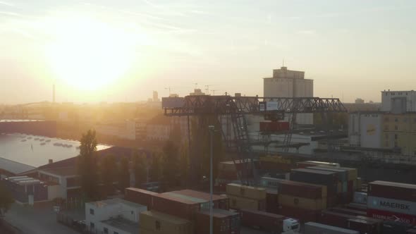 Port in Early Morning Sunrise with Cargo Containers and Cranes, Aerial Foward alt