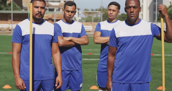 Soccer players standing on field alt