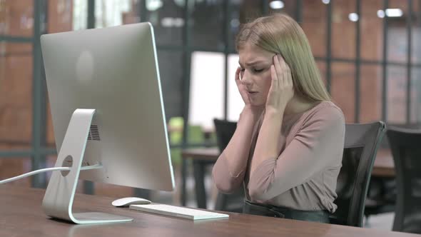 Tired Woman Having Headache While Working on Computer alt
