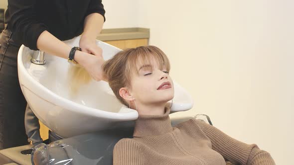 Professional Hairdresser in Beauty Saloon with Clients alt