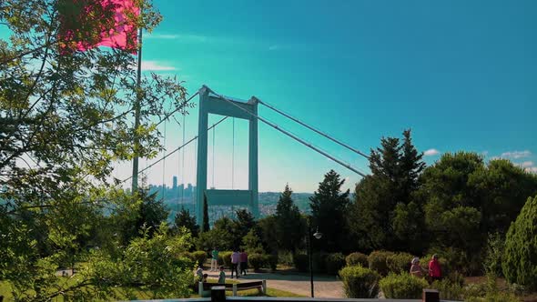 Fatih Sultan Mehmet Bridge and Turkish Flag with cityscape of Istanbul from Otagtepe.