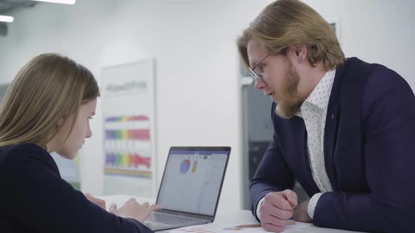 Successful Independent Confident Boss in a Business Suit Flirting with a Subordinate or Secretary alt