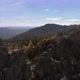 Aerial view of the mountains with rocks and beautiful autumn woods on the slopes - VideoHive Item for Sale