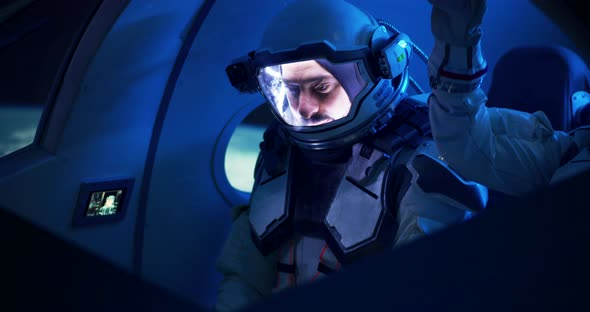 Male and Female Astronauts Navigating Spaceship, Stock Footage | VideoHive