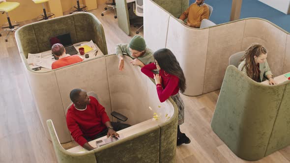 Top View of People Chatting in Modern Office alt