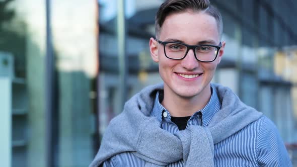 Smiling Man Portrait Near Modern Office Building alt