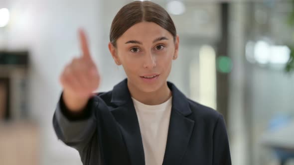 Portrait of Businesswoman with Pointing with Finger  alt