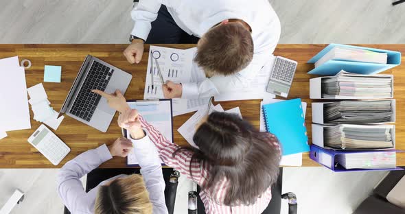 Group of Businesspeople Seeing Information in Laptop and Rejoicing Top View  Movie Slow Motion alt