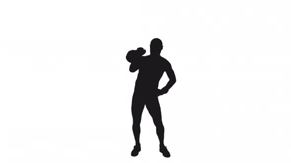 Silhouette Of Sportsman Doing Single Arm Kettlebell Press Pushup