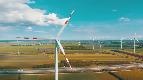 Aerial View of Wind Turbines Farm and Agricultural Fields. Austria. alt