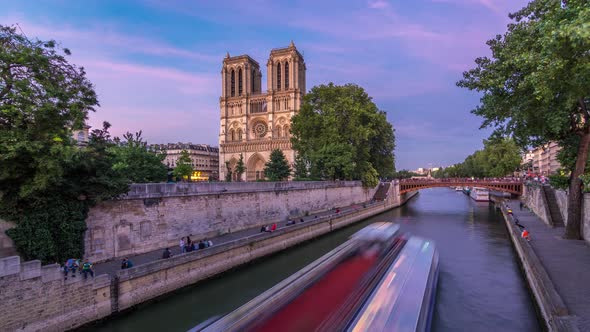 Front View of Notre Dame De Paris Cathedral Day to Night Timelapse After Sunset alt