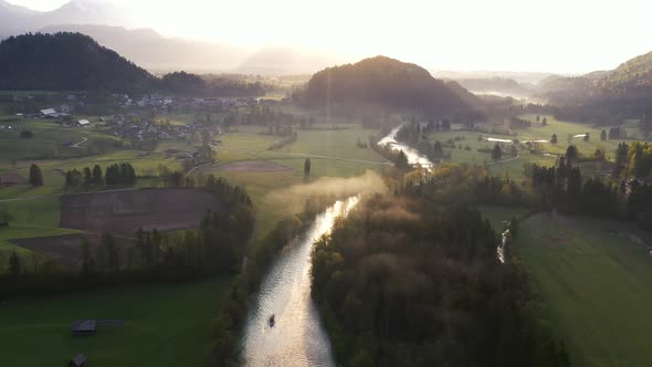Flying over countryside towards the hills and mountains alt