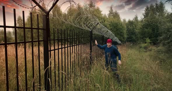 Man Climbed the Fence with Barbed Wire and Leaves Crime Scene