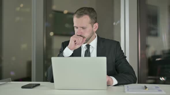 Sick Businessman Having Coughing in Office at Night alt