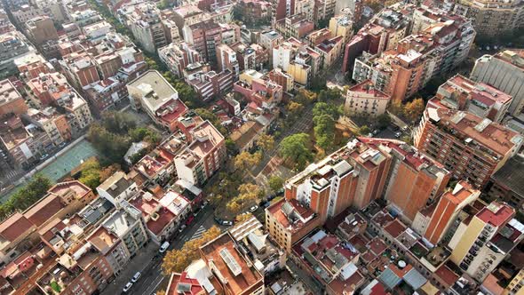 Aerial drone view of Barcelona, Spain. Blocks with multiple residential buildings, roads with cars alt