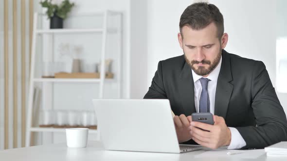 Businessman Using Smartphone for Online Financial Trading alt