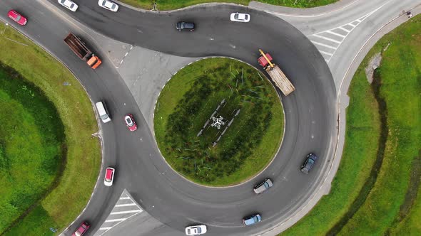 Cars Drive Around Large Turning Circle in Rural Area alt