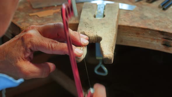 Craftswoman working in workshop alt