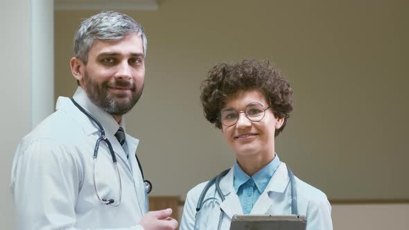 Portrait of two doctors with tablet computer