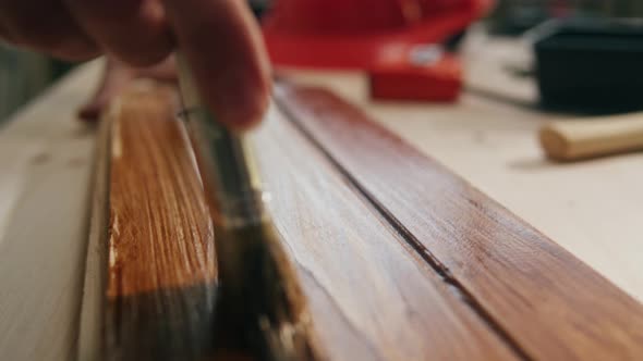 Varnishing Wooden Board Closeup alt