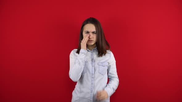 The Young Woman Has a Sore Nose She Touches It with Her Hand alt