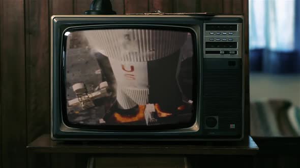 Vintage Footage of the Launch of the Apollo 11 Saturn V Rocket on a Retro TV. alt