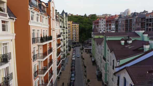 Thin Street Road Amoung Colored European Buildings alt
