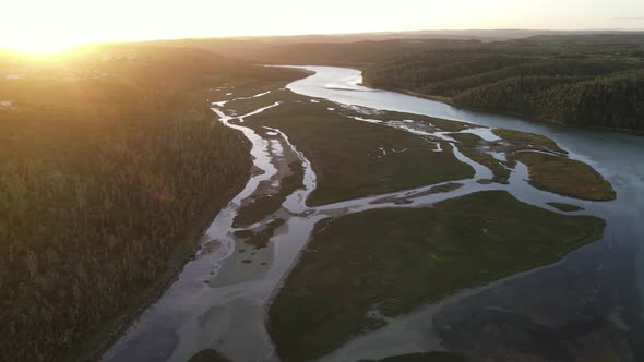 Aerial View of Drone Flying Over River During Sunset