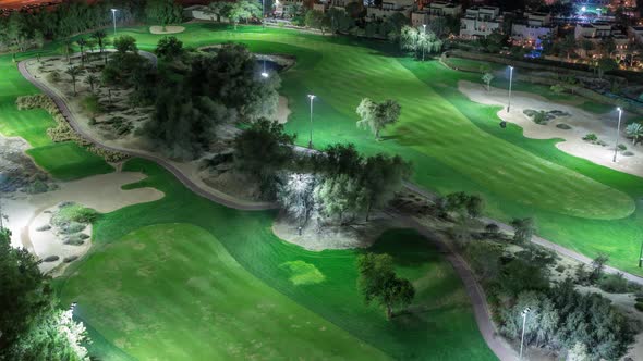 Aerial View to Golf Course and Villas with Houses Night Timelapse alt