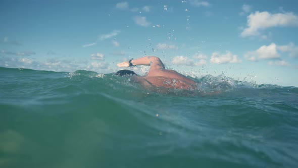 Professional Triathlete Swimming On Lake At Sunset. Swim Preparing To Triathlon Competition. alt