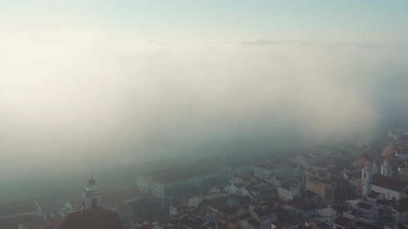Aerial view; touristic capital of Portuguese over the fog; sunrise time in Lisbon