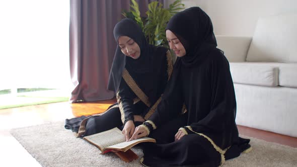 Pretty Muslim women learning about Quran together