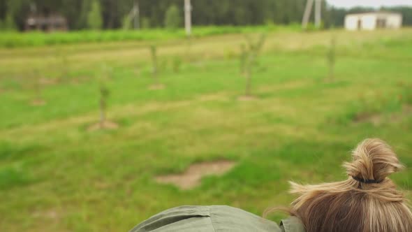 A Blondhaired Mother and Her Son Higging and Laughing in Summer Garden alt